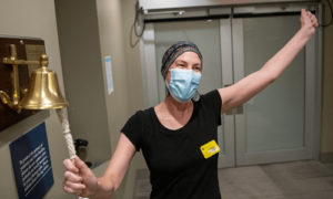Carlin rings the bell to mark her last day of treatment at the Mass General Cancer Center.