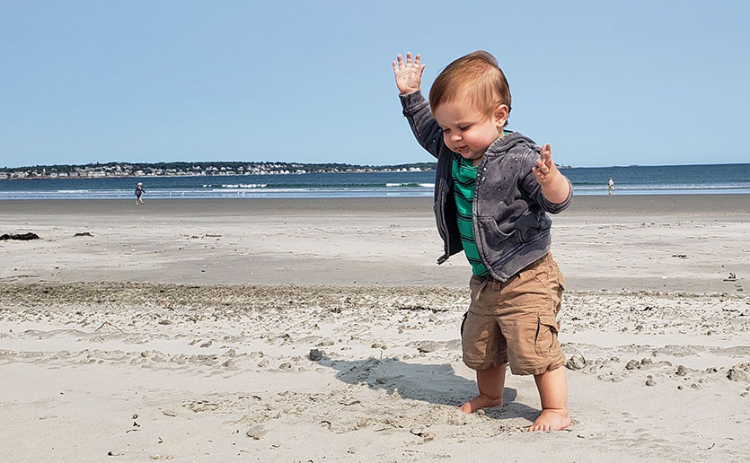 Baby walking on the beach