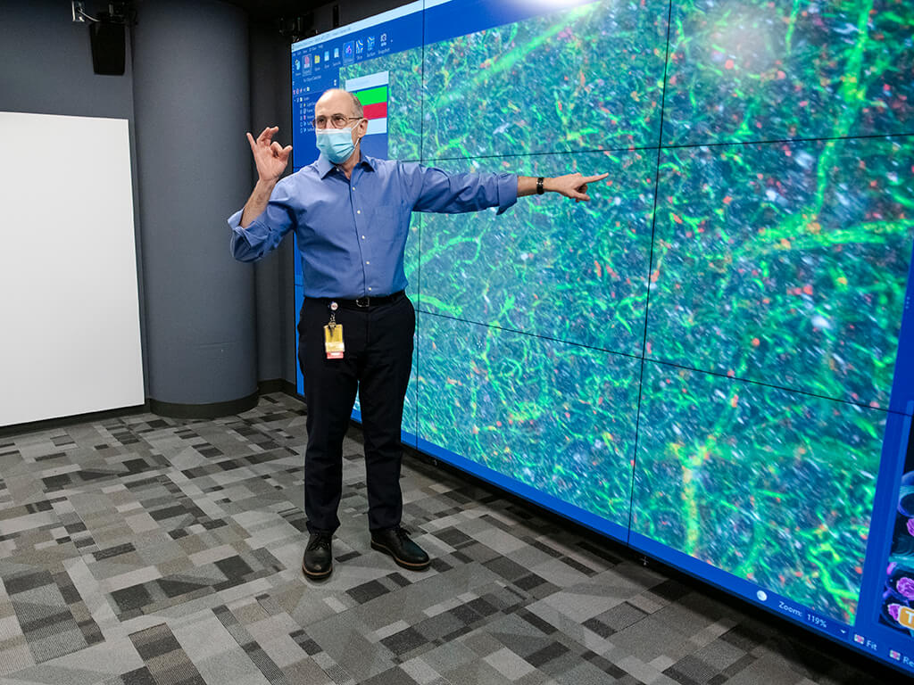 Man pointing to digital screen