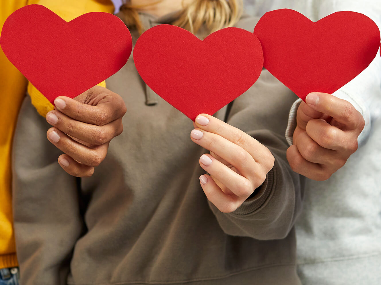hands holding heart shapes